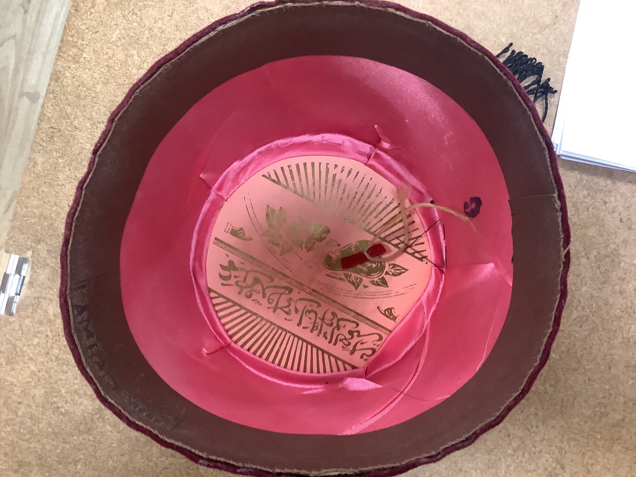 A Moroccan Fez and a Panama hat in a Dunn & Co hat box together with a hat stand